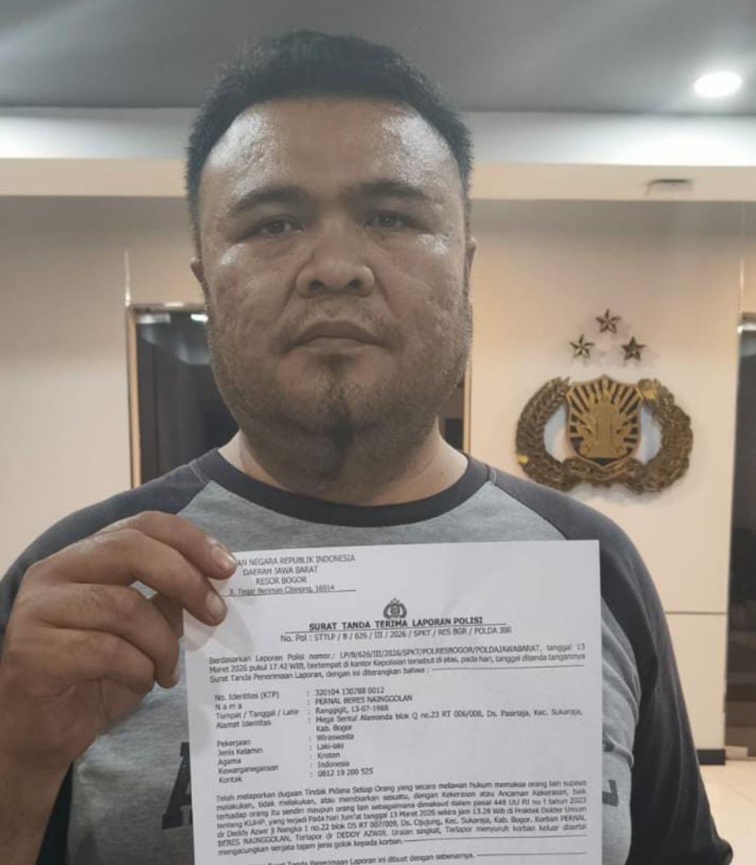 Korban pengancaman tunjukan surat laporan polisi (foto ist) 