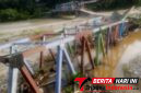 Foto : Kendati membahayakan dan mengancam pemukiman warga, terutama saat debit air bertambah. Namun, puing Jembatan rangka baja Mbarung masih dibiarkan berada di tengah aliran sungai Alas Aceh Tenggara. (Abdul ganigasek.).