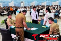 Walikota Hengky Honandar S.E, Bersama Gubernur Sulut, Yulius Selvanus pada kegiatan Harganas ke-33